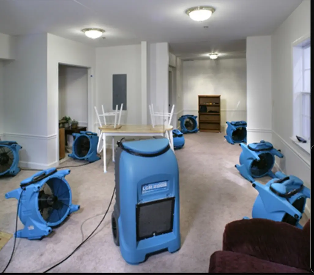 Air movers and dehumidifier setup for Water Damage Restoration in Fairmont